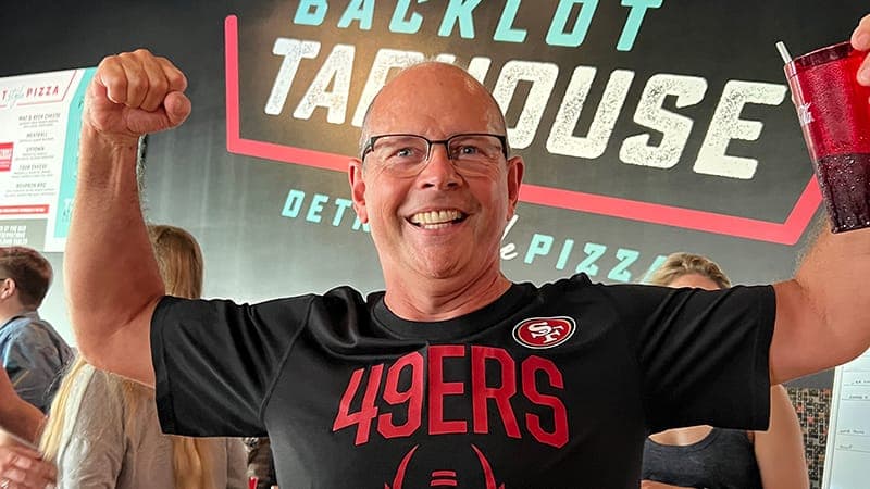 An employee celebrating the 49ers