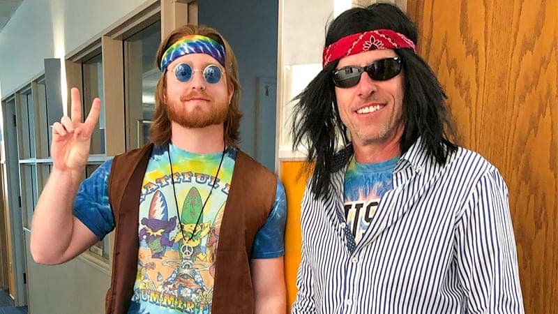 Two employees dressed up as hippies