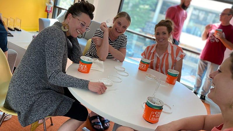 Laughing people around a table