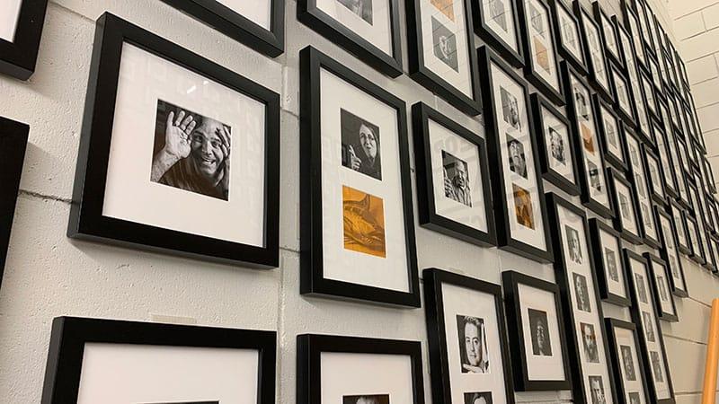 Employee portraits hanging on the wall