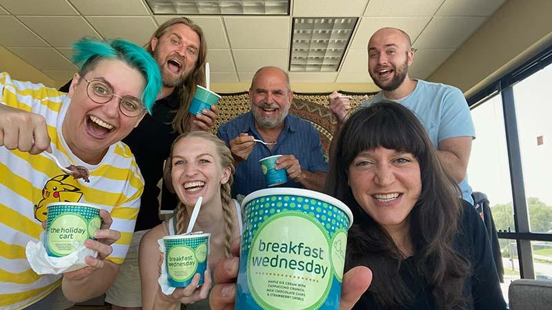 A group of excited employees with ice cream