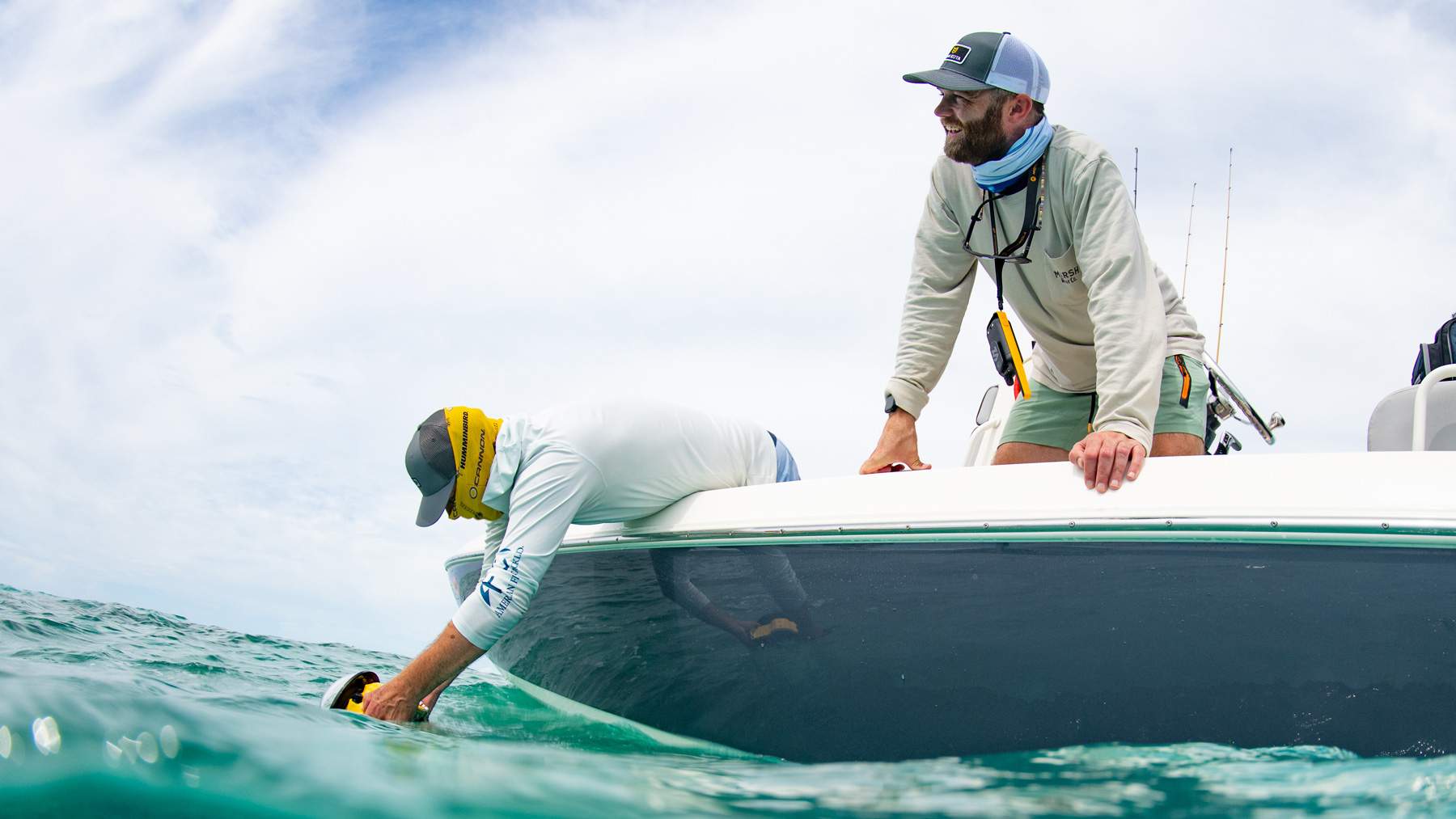 Team on a boat during a fishing photoshoot.